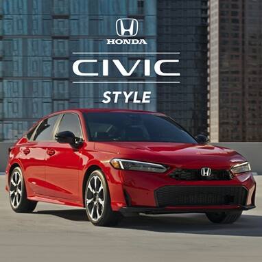 2027 Honda Civic Sedan Sport Touring Hybrid in Rallye Red front parked on a rooftop with buildings (Compact Sedan).